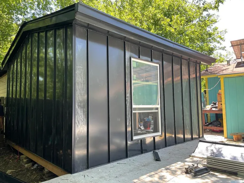 Black standing seam metal wall panels for Roof Inspection in Waverly